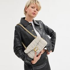 A modern take on an archival 1970s Coach design our structured Tabby shoulder bag is crafted of quilted plush ultra-soft nappa leather. Finished with our Signature hardware for an iconic touch the compact 26 features a long leather chain strap to wear crossbody or double up for a shorter dressier look. | Coach Tabby Shoulder Bag 26 With Pillow Quilting - Women's - Brass/chalk Everyday Clutch Bag With Cc Turnlock Closure, Clutch Bags With Cc Turnlock Closure For Everyday, Cc Turnlock Clutch Bag, Luxury Bags With Cc Turnlock Closure For Work, Chic Rectangular Shoulder Bag With Cc Turnlock Closure, Modern Satchel Shoulder Bag With Cc Turnlock Closure, Rectangular Shoulder Bag With Cc Turnlock For Work, Designer Shoulder Bag With Cc Turnlock Closure For Everyday, Luxury Flap Bag With Cc Turnlock Closure For Work