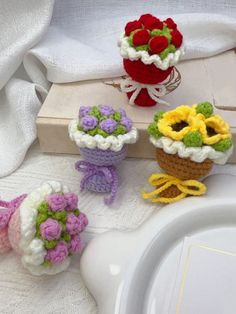 small crocheted flowers are sitting on a table