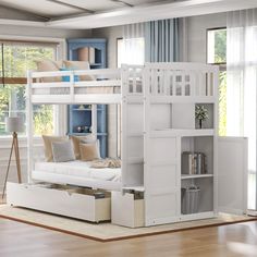 a white bunk bed sitting in a living room next to a window