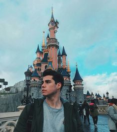 a man standing in front of a castle