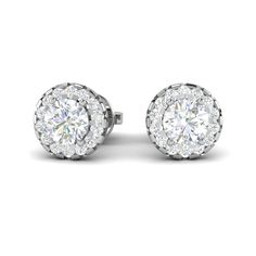 Platinum Earrings by Jewelove Metal : Platinum Platinum Purity : 95% Purity Mark : Pt 950 Finishing : Hi-polish Gemstones : Natural Diamonds Solitaire Carat Weight : 1.40 cts. (0.70 cts. each) Solitaire Color : J Solitaire Clarity : VS Side Diamond Weight : 0.56 cts. Side Diamonds Color : GH or IJ (as selected above) Side Diamonds Clarity : VVS or SI (as selected above) Estimated Gold weight : 3 grams Diamond Grading Report : SGL Certificate of Authenticity : Platinum Guild International Diamond Classic Round Halo Design Earrings, Classic White Round Cut Cluster Earrings, Classic Round Halo Earrings, Halo Design Round Cut Earrings For Anniversary, Classic White Round Cluster Earrings, Classic White Cluster Earrings, Classic Halo Round Cut Earrings, Classic Halo Design Earrings For Anniversary, White Halo Setting Round Cut Bridal Earrings