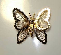 "This is a beautiful Monet open winged gold tone wire filigree butterfly pin. This would make a great addition to any collection! Measures: 2.5\" Every order comes in a beautiful gift bag." Gold Butterfly Brooch For Formal Occasions, Gold Butterfly Brooch For Wedding, Gold Butterfly Brooches For Wedding, Gold Butterfly Brooch As Gift, Gold Butterfly Brooch For Gift, Gold Butterfly Brooches For Gift, Gold Butterfly Brooch Gift, Gold Filigree Ornate Brooches, Evening Butterfly Brooch