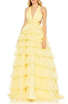 Tiers of flowy ruffles and a dramatic open back with crisscrossing straps elevate this occasion-ready gown to a scene-stealing status. 62 1/2" length Plunge neck Sleeveless Lined 100% polyester Spot clean Imported Bold Prom Dresses, Mac Duggal Prom, Prom Dress Plus Size, Prom Ball Gown, Plus Size Party Dresses, Prom Dresses Sleeveless, Chiffon Fashion, Pleated Bodice, Mac Duggal