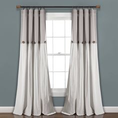 the curtains in this room are white and grey with brown trimmings on them