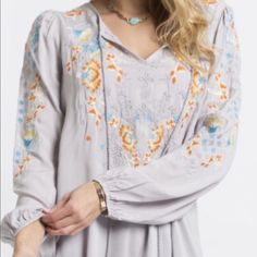 Long Sleeve Blouse With Floral Embroidered Detailing On Front Loose Fit , Woven Relaxed 100 % Rayon First Photo Is Closest To The Correct Color. Spring Embroidered Hem Tunic Top, Spring Tunic Blouse With Embroidered Hem, Embroidered Long Sleeve Blouse For Brunch, Long Sleeve Embroidered Blouse For Brunch, Spring Embroidered Flowy Top, Embroidered Flowy Spring Top, Flowy Embroidered Spring Tops, Spring Long Sleeve Blouse With Multicolor Embroidery, Spring Multicolor Embroidery Peasant Top With Long Sleeves