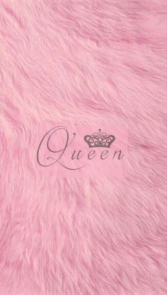 the word queen is written in cursive writing on a pink fur textured surface