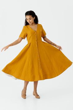 Embrace sophistication with the Agness Linen Dress. The tailored fit, full circle skirt, and V-neckline with short classic sleeves create a timeless look. Perfect for weddings or upscale events, the dress is crafted for both comfort and style. Discover more from Sondeflor Shop here: https://www.etsy.com/shop/SondeflorShop DRESS DESIGN FEATURES: * Tailored fit * Full circle skirt with white interior lining on the bottom hem * V-neckline  * Short Classic Sleeves with white interior lining * Button Elegant A-line Linen Dress For Garden Party, Classic Dress With Fitted Bodice, Tea Length, Classic Tea Length Dress With Fitted Bodice, Classic Tea-length Dress With Fitted Bodice, Classic A-line Midi Dress For Garden Party, Classic Fitted Dress With Flared Skirt, V-neck Dress With Fitted Bodice For Garden Party, Classic Formal Dress With Flared Skirt, Classic A-line Dress For Dress Down Occasions