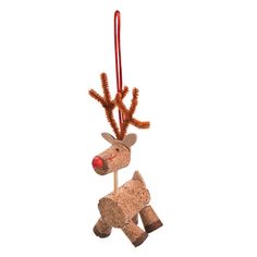 a reindeer ornament hanging from a red ribbon