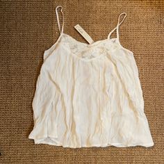 Beautiful Cream/White Lace Tank Top From Elodie. Perfect Dressed Up Or Down. Staple Item. Soft Fabric With Elegant Lace Trim. Make An Offer If Interested! Thanks For Shopping! Spring Cami Tops With Lace Trim, Summer Tops With Lace Trim For Daywear, Casual White Crochet Lace Top, Summer Lace Trim Tops For Daywear, Casual White Lace Trim Top, Off White V-neck Top With Lace Trim, White Cotton Lace Top For Beach, White Cotton Lace Top For The Beach, White Camisole For Spring