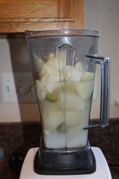 a blender filled with white liquid on top of a counter