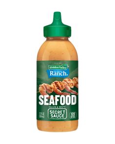 a bottle of seafood sauce on a white background