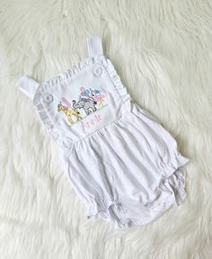 This listing is for a white sunsuit with animals and name. This is such a sweet outfit! I can change thread colors. If you want different colors used message me. Playful White Jumpsuits And Rompers For Playdate, Playful White Jumpsuit For Playdate, Playful White Cotton Jumpsuits And Rompers, White Summer Bubble Romper For Playdate, White Bubble Romper For Playdate In Summer, Cute White Jumpsuit For The Beach, White Bubble Romper For Summer Playdate, Playful White Onesie For Playdate, White Bubble Romper For Playwear In Fun Style