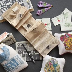 several pieces of fabric and paper laid out on a table