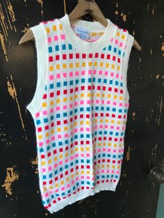 "Fantastic vintage 60's/70's mod colorful square pattern knit sleeveless sweater top. Longer fit, but can be tucked in nicely. 100% acrylic. In good vintage condition. Made by RJ Pumpkin. Will best fit medium. Measurements laying flat: fabric stretches Armpit to armpit: 18\" Length: 25\"" Multicolor Fitted Retro Tank Top, Fitted Multicolor Sweater Vest For Fall, Retro Multicolor Sleeveless Vest, Multicolor Sleeveless Vest For Fall, Multicolor Sleeveless Sweater Vest For Fall, White Fitted Retro Sweater Vest, Retro Multicolor Summer Vest, Multicolor Retro Summer Vest, Vintage Multicolor Sleeveless Sweater Vest