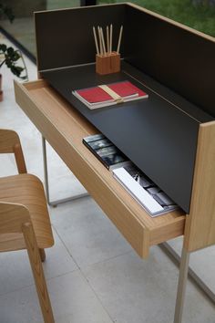 a desk with a book and some books on it