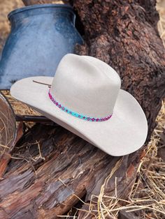 Step into the world of personalized Western style with our exquisite Cowboy/Cowgirl Hat Bands! Each band is expertly handcrafted and made-to-order, allowing you to select the colors and design that perfectly complement your unique taste. Whether you prefer a touch of rugged charm or a dash of feminine elegance, we've got you covered. Reach out to us today, and we'll be thrilled to guide you through our wide array of captivating color options, ensuring you find the ideal hat band to add a dash of Handmade Multicolor Hat Bands For Rodeo, Multicolor Beaded Hats For Rodeo, Artisan Multicolor Hat Bands For Country Events, Artisan Beaded Hats For Country Events, Multicolor Beaded Hat Band For Rodeo, Custom Multicolor Flat Brim Hats, Cowgirl Hat Bands, Beaded Hat Bands, Ombre Pattern