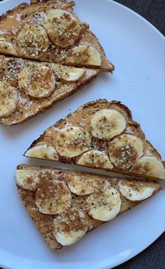 two slices of toast with bananas on top