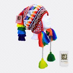 "This colorful Chullo is a handmade hat made by indigenous from the Andes in Pisac Cusco - PERU, woven in multicolored wool yarn, with ear flaps and decorated with beads all around, which are sewn one by one. This particular one has a design of the \"Andean Llama\",South American camelid from the Andean cultures. If laid flat, the Chullo alone is approximately 12\" long x 10.5\" wide. Including the pompoms on the bottom and all of the top, it measures from end to end 24\" approximately The CHULL Traditional Adjustable Beanie Hat, Adjustable Rainbow Hat For Festivals, Bohemian Multicolor Crochet Hat For Festival, Multicolor Bohemian Crochet Hat For Festivals, Bohemian Multicolor Woven Crochet Hat, Colorful Bohemian Crochet Hat, Multicolor Bohemian Beanie Hat, Colorful Handmade Hats For Festivals, Multicolor Bohemian Beanie