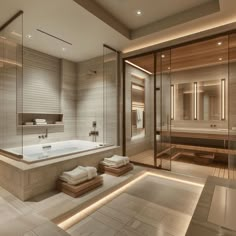 a bathroom with a large bathtub next to a walk in shower