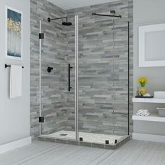 a walk in shower sitting inside of a bathroom