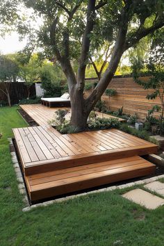 floating deck around a tree idea using deck blocks Backyard With Tree In The Middle, Diy Deck Around Tree, Tree In Patio, Small Deck Around Tree, Wood Deck Around Tree, Terraced Side Yard, Hardscape Around Tree, Backyard With A Lot Of Trees, Unused Garden Space Ideas