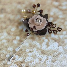 Leather flower lapel pin Pearl beads brooch is Handmade beaded brooch for Wedding and Evens.  Beaded flower brooch can be a beautiful Wedding boutonniere lapel pin. The elegant flower pin made with faux Pearl beads, Sunstone beads and seed beads.  The length of the leather flower lapel pin  is 4.0 inches   Leather floral pin  Diameter is approximately 2.0 inches Color - beige, khaki, brown Exquisite leather brooch is perfect men flower lapel pin for any clothes. Add class to your look with this handmade plant brooch! This branch flower pin/ beaded shawl pin can be a beautiful gift!  More brooches and pins can see here:  https://etsy.me/3eBaTnB Beads Brooch, Leather Brooch, Beaded Shawl, Brooch Wedding, Flower Lapel, Wedding Boutonniere, Flower Lapel Pin, Handmade Plant, Shawl Pin