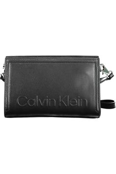 Elevate your accessory game with the sleek and sustainable Calvin Klein shoulder bag. Expertly crafted with a forward-thinking blend of 51% polyester and 49% polyethylene, this bag takes a bold step into eco-chic territory, offering a removable shoulder strap for versatile styling. Stash your essentials in the nifty internal card pocket, and trust the secure zip closure to keep your valuables safe. Punctuated with the unmistakable Calvin Klein logo, this black beauty captures the essence of modern luxury. Material: 51% Polyester, 49% Polyethylene Country of origin: KH Color: Black Calvin Klein Shoulder Bag, Eco Chic, Wedge Pumps, Conscious Fashion, Black Shoulder Bag, Calvin Klein Black, Look Casual, Leather Hobo, Black Handbags