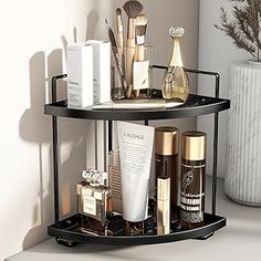 two tiered shelf with cosmetics and personal care items on it next to a vase