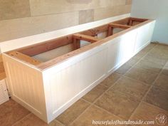 an unfinished kitchen counter in the middle of a room with tile flooring and white walls