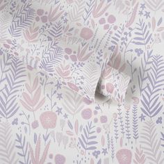 a pink and purple floral wallpaper with leaves on the bottom right hand corner is shown