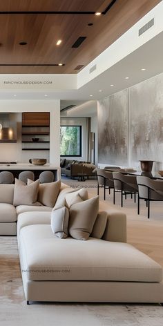 a living room with couches, tables and chairs in the middle of the room