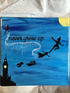 a painting that says never grow up on the side of a blue background with silhouettes of people flying in the sky