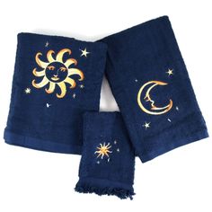 two towels with sun and moon designs on them