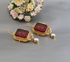 Description Gemstone -Red Glass Material - Brass Gemstone Size - 18X13 mm Earring Height Including Hoop - 5 cm Earring Width - 2 cm Finish - Smooth and high polished with brilliant shine. Natural stones may vary slightly in shape, size and color.Handmade Item You will receive the same piece as in the picture or identical. Since all gemstones are different from each other, I cannot guarantee that the gemstone you see above will still be available.. But I assure you will get same quality piece as shown in the above picture.# Your order will be dispatch within 3-5 working days after receiving order# Items will be sent via registered airmail and take approx. 15-20 days to arrive. #Express mail Via FedEx/DHL/Aramex, is available for an extra charge at checkout. Red Victorian Earrings As Gift, Victorian Red Earrings As Gift, Antique Jeweled Earrings For Gift, Antique Red Earrings For Anniversary, Red Jeweled Earrings For Wedding, Victorian Red Earrings For Wedding, Red Oval Wedding Earrings, Antique Red Jewelry With Matching Earrings, Red Jeweled Earrings For Gift