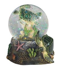 a snow globe with sea turtle and starfish inside