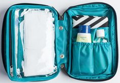 an open blue suitcase with its contents in it on a white surface, including toiletries and other items