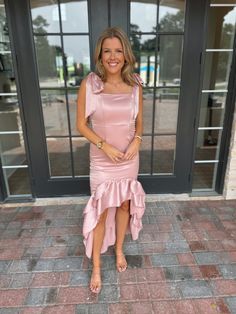 Stunning mauve pink satin maxi dress with tie straps and ruffle detailing at the bottom. Model is 5'4" with a 28" waist, 34" bust, and 35" hips wearing a small. Elegant Pink Maxi Dress With Ruffled Skirt, Elegant Pink Maxi Dress With Ruffled Straps, Satin Prom Dress With Ruffle Hem, Pink Ruffled Midi Dress For Prom, Sleeveless Satin Dress With Ruffled Skirt, Pink Satin Bridesmaid Midi Dress, Pink Ruffle Hem Midi Dress For Evening, Pink Midi Dress With Ruffle Hem For Evening, Pink Maxi Dress With Ruffle Hem For Evening