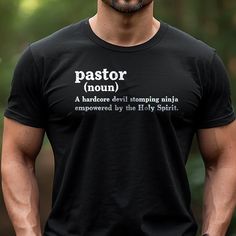 Celebrate your favorite pastor with this humorous t-shirt! The design features a playful definition of "Pastor" as "a hardcore devil stomping ninja empowered by the Holy Spirit." This shirt is perfect for pastors, church staff, or anyone who appreciates a good laugh and a strong faith. Made from soft, comfortable fabric, it's perfect for everyday wear or special occasions. Pastor Shirt, Faith Shirts, Pastor Appreciation, Pastors Appreciation, Circuit Ideas, Faith Clothing, Strong Faith, Boring Day, Tshirt Design Men