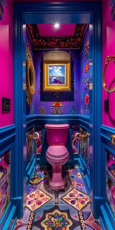 a brightly colored bathroom with a pink toilet and blue walls, painted in bright colors