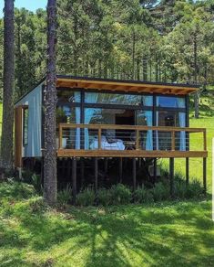 a small house in the middle of some trees