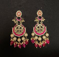 HOT PINK CHANDBALI EARRINGS - WOMEN'S TRADITIONAL MEENAKARI JEWELRY Elegant set of earrings with beautiful Meenakari work. A versatile pair of earrings with pink & Gold Meenakari, Kundan and Pearl drop. The engraved traditional design adds an artisanal touch to the earrings. Details: Handcrafted Jewelry Metal: Metal Alloy, Gold Plated Stone:  Meenakari, Pearls &  Pink Gems Style: Contemporary yet Traditional Closure:  Push back clasp B Anu Designs jewelry pieces can be customized in accordance w Cheap Meenakari Chandbali Jewelry, Luxury Meenakari Chandbali Earrings, Luxury Chandbali Danglers With Meenakari, Pink Chandbali Bridal Earrings Gift, Elegant Pink Dangle Chandbalis, Pink Bollywood Jewelry, Pink Bridal Earrings For Festive Occasion, Festive Pink Bridal Earrings As Gift, Festive Pink Bridal Earrings For Gifts