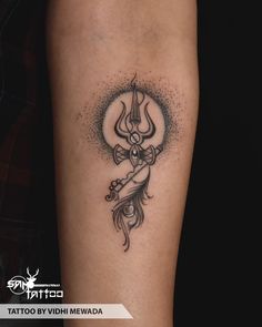 a tattoo on the arm of a woman with a flower and an arrow in her hand