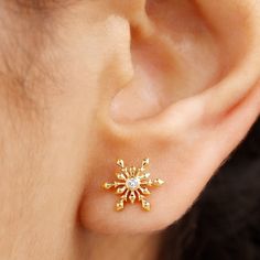 Product Details Add a touch of elegance to your look with these stunning Snowflake Earrings. Crafted in Gold, these Screw Back Stud Earrings feature a Round Cut Diamond set in a bezel at the center of a beautifully designed snowflake. Comfortably secured with screw backs, these Diamond Stud Earrings are perfect for everyday wear. Make a stylish statement and upgrade your jewelry collection with these eye-catching April Birthstone Earrings. Product Information SKU SHP-EARRINGS082210136 Weight 1.5 Elegant Jewelry For Anniversary In Winter, Elegant Festive Jewelry For Winter, Elegant Christmas Anniversary Earrings, Sparkling Gold Diamond Earrings Gift, Sparkling Yellow Gold Diamond Earrings Gift, Gold Earrings As Winter Gift, Elegant Winter Gift Earrings, Elegant Gold Earrings For Winter, Elegant Winter Earrings For Pierced Ears