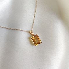 This stunning pendant is set in 14K Solid Yellow Gold with Natural Citrine with utmost precision. It is an unique gemstone pendant for nearly every occasion and is completely hassle-free jewelry. ITEM DETAILS * Gem: Citrine * Gem Size: 8X10mm * Gem Shape: Octagon * Gem Weight: 3.75 carats * Gold Purity: 14KT  * Gold Weight: 0.61 gram * Total Weight of the Pendant: 1.36 gram The Gold purity is guaranteed and it comes with authentic 14KT gold hallmark. Since my items are handmade, they are absolutely nickel and lead free. CUSTOMIZATION * Gemstone customization is available and it can be substituted with a gem of your choice. Kindly message me for the same. PACKAGING * The Pendant comes with layers of safe and secure wrapping along with Free handmade jewelry box with every purchase. ➡️Head to Luxury Yellow Gold Jewelry For May Birthstone, Topaz Jewelry Yellow, Luxury Citrine Gemstones For Gifts, Exquisite Yellow Gold Gemstones For Gifts, Yellow Gold Topaz Gemstones As Gift, Amber Citrine Gemstones For Gift, Orange Jewelry With 17 Jewels As A Gift, Octagon Shaped Citrine Jewelry In Yellow Gold, Yellow Gold Citrine Gemstones For Gift