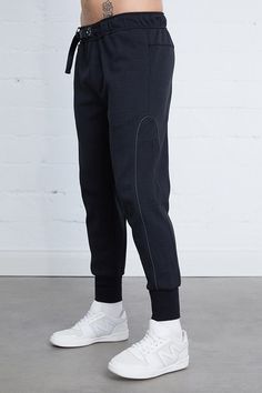 Stay comfortable and stylish with our Amethyst Warm Up Joggers. These knit joggers feature a belted waist for a perfect fit and 3M reflective piping details for added visibility. With hidden zipper pockets, you can keep your essentials safe while on the go. 67% Polyester 33% Cotton Model is 6'2" and wearing a size medium in BlackModel is 6'0" and wearing a size medium in Sand Fitted Black Sweatpants With Ribbed Waistband, Black Jogging Pants With Elastic Cuffs, Black Athleisure Joggers With Elastic Cuffs, Sporty Fitted Bottoms With Belt Loops, Fitted Sporty Bottoms With Belt Loops, Black Bottoms With Ribbed Cuffs And Tapered Leg, Black Tapered Leg Bottoms With Ribbed Cuffs, Fitted Black Winter Joggers, Functional Black Joggers With Ribbed Waistband