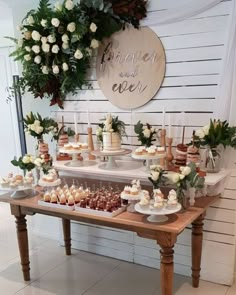 a table topped with lots of cakes and cupcakes