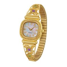 The glory of spring all year long! Enjoy fresh and lovely flowers all year round...in a stylish watch that makes every minute a delight! Fashioned with glistening gold-tone flowers that beckon with vivid simulated amethyst and peridot. Luxuriously appointed with your name attractively engraved on the reverse. Elegant iridescent mother-of-pearl face and precision quartz movement for classic glamour and dependable timekeeping. Cute Gold Watch, Flower Watch, Cute Watches, Preppy Jewelry, Jewelry Essentials, Jewelry Accessories Ideas, Stacked Jewelry, Classy Jewelry, Dope Jewelry