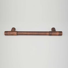 a wooden handle on a white wall