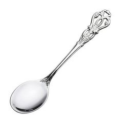 a spoon with an ornate design on the side and a long, slender handle is shown