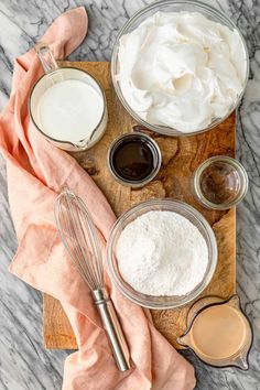 ingredients to make homemade whipped cream on a cutting board